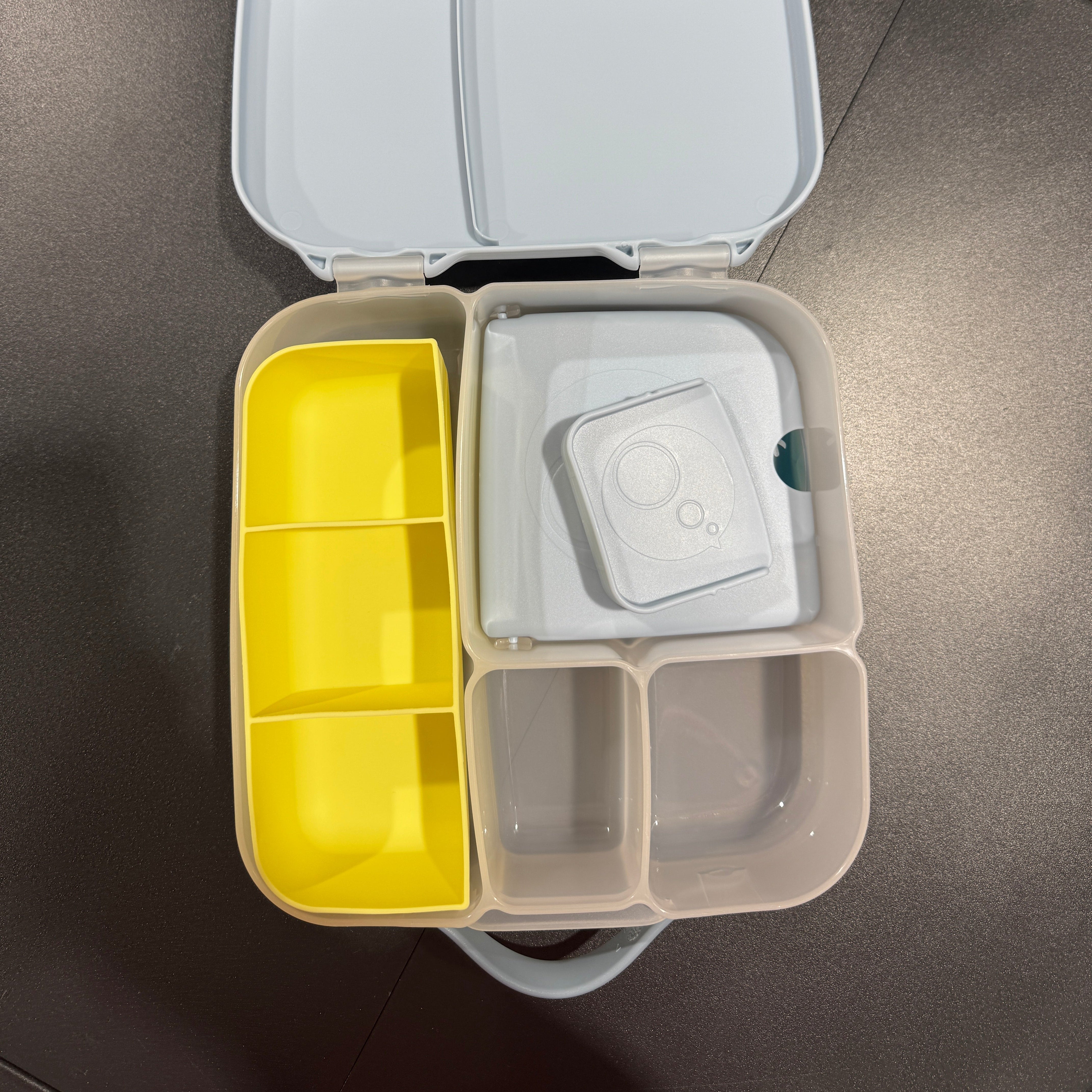 Yellow feast tray in bbox lunch box
