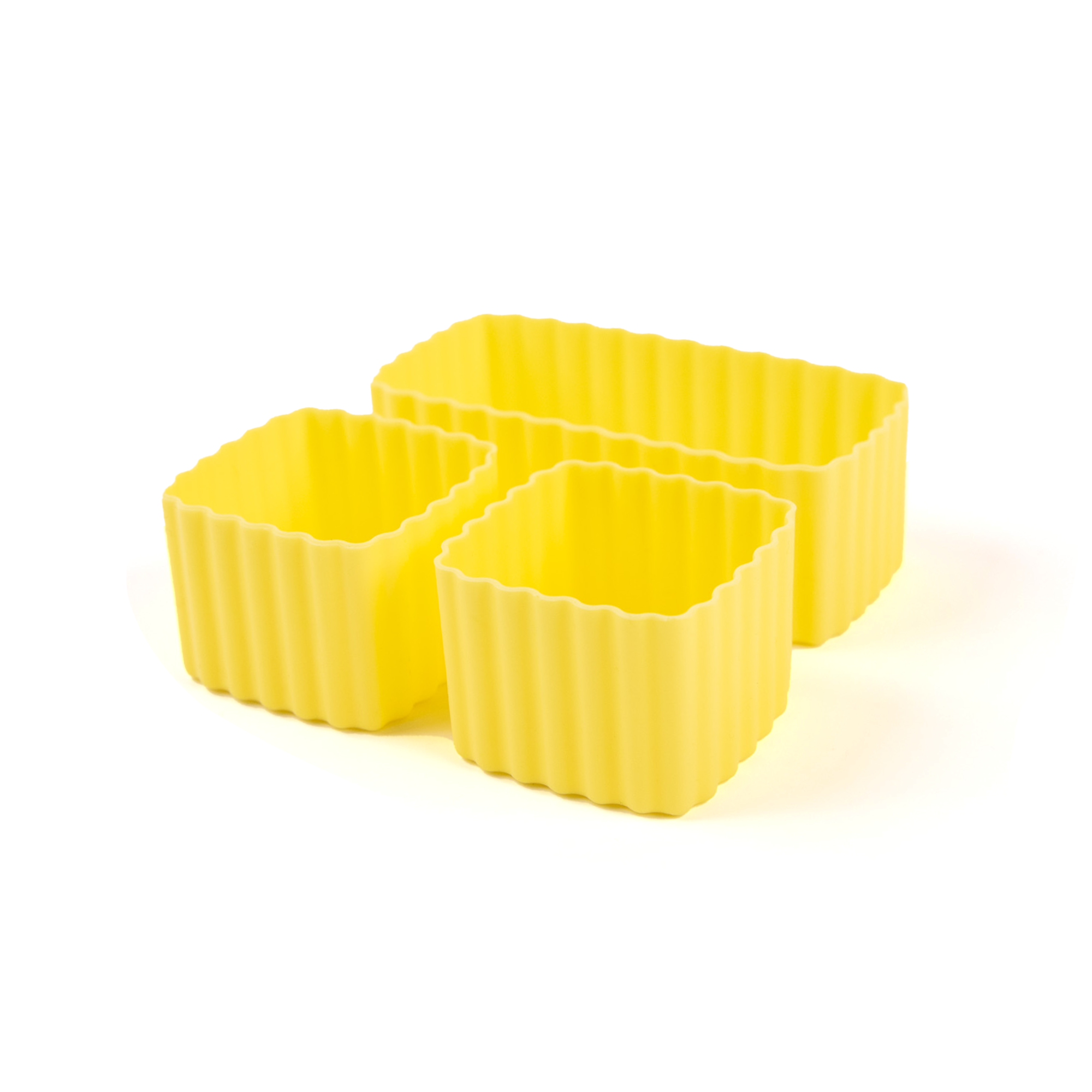 Three yellow silicone containers with ribbed texture on a white background