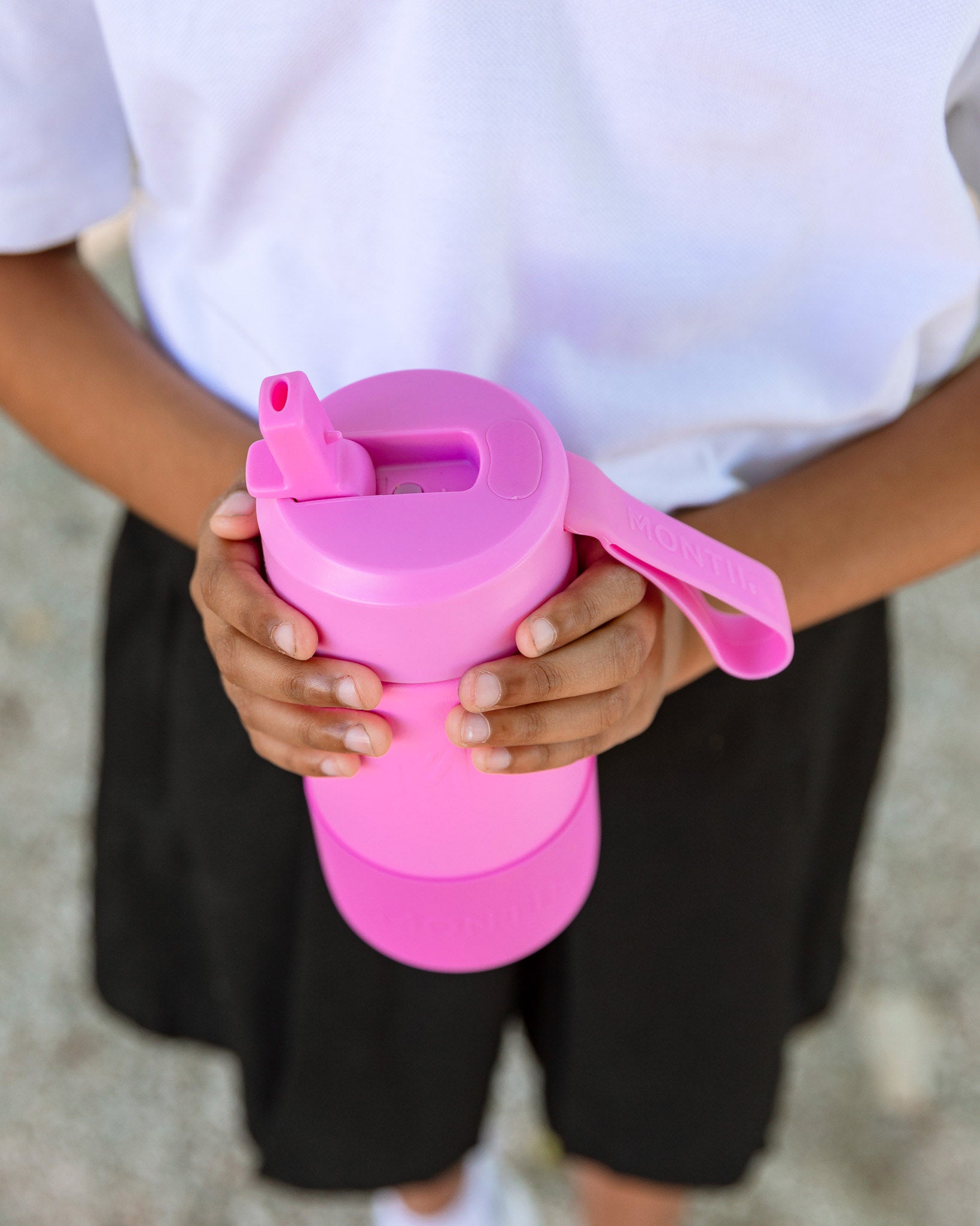 Pink water bottle with sipper lid and straw from MontiiCo